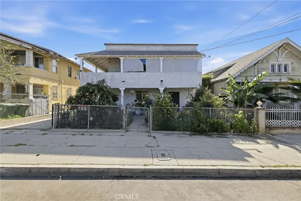 a front view of a house with garage