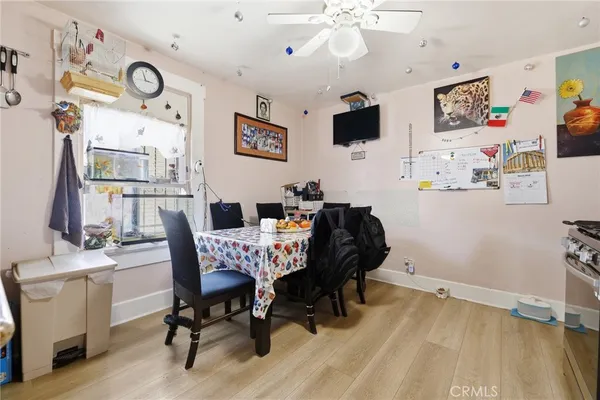 a view of a workspace with furniture and a flat screen tv
