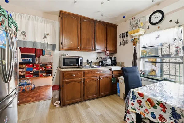 a kitchen with stainless steel appliances a stove a sink and a refrigerator