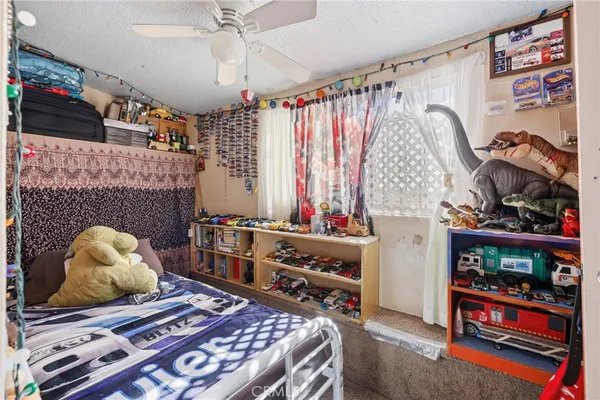 a bedroom with furniture and a fireplace