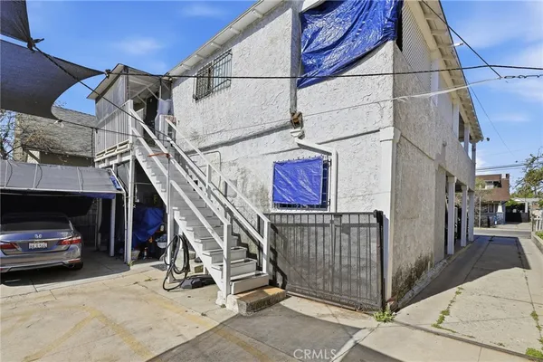 a view of a car park in front of house