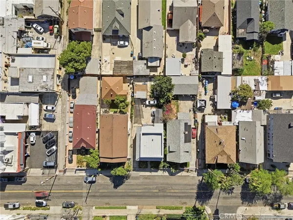 an aerial view of residential houses with outdoor space