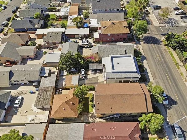 an aerial view of residential houses with outdoor space