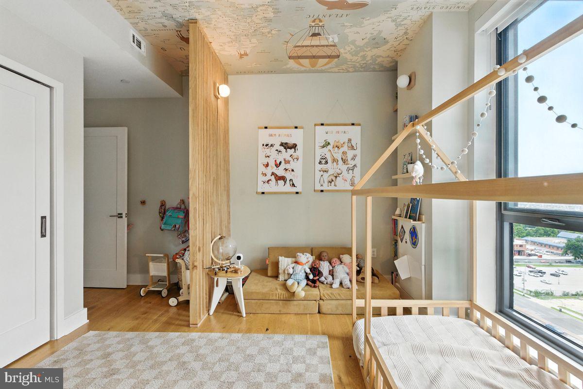 1211 Van Street Southeast, Unit PH13B Washington, DC 20003 - Photo 14 of 25 a view of a livingroom with furniture and a window