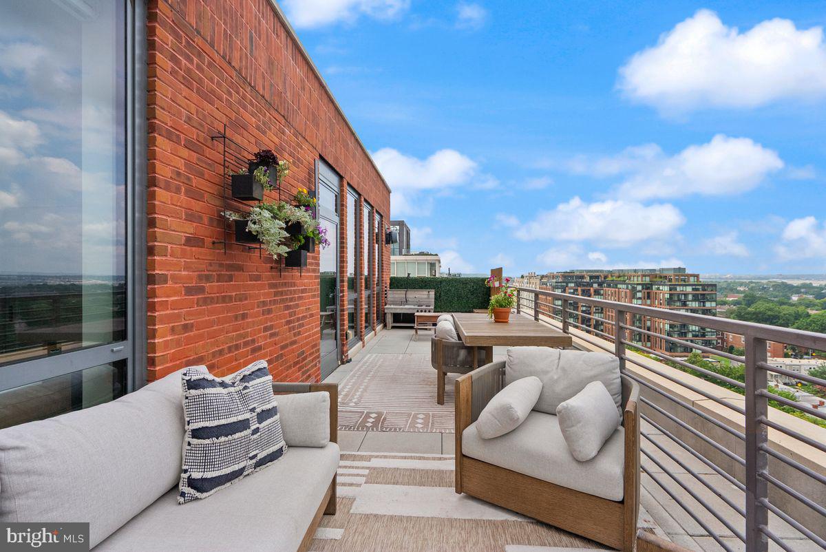 1211 Van Street Southeast, Unit PH13B Washington, DC 20003 - Photo 19 of 25 a view of roof deck with couches and potted plants
