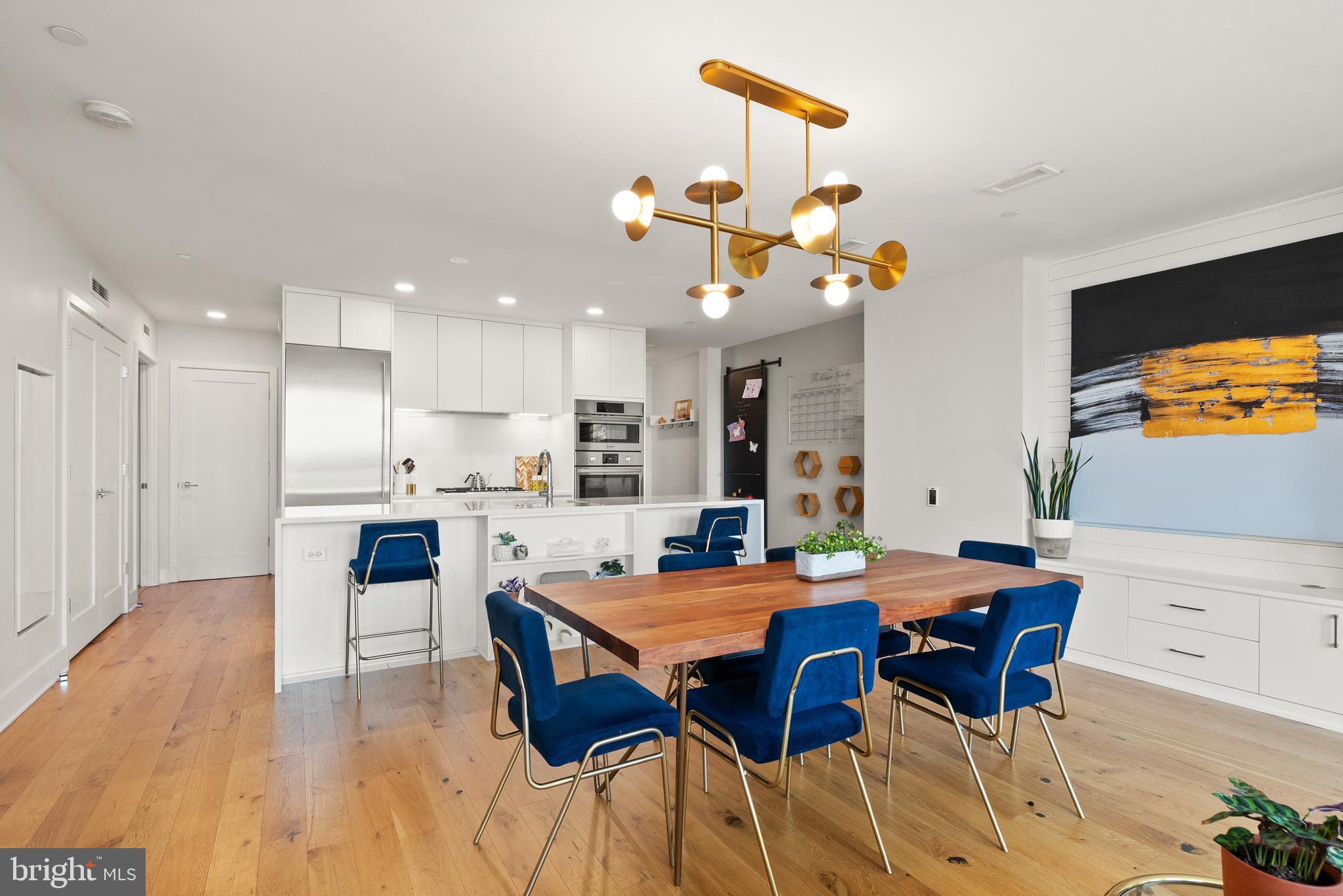 1211 Van Street Southeast, Unit PH13B Washington, DC 20003 - Photo 7 of 25 a view of a dining room with furniture and wooden floor
