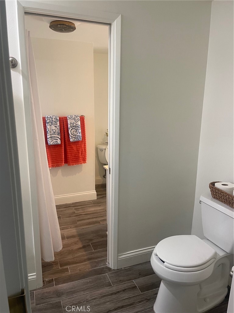 23033 Maple Avenue Torrance, CA 90505 - Photo 20 of 26 a bathroom with a toilet and a shower