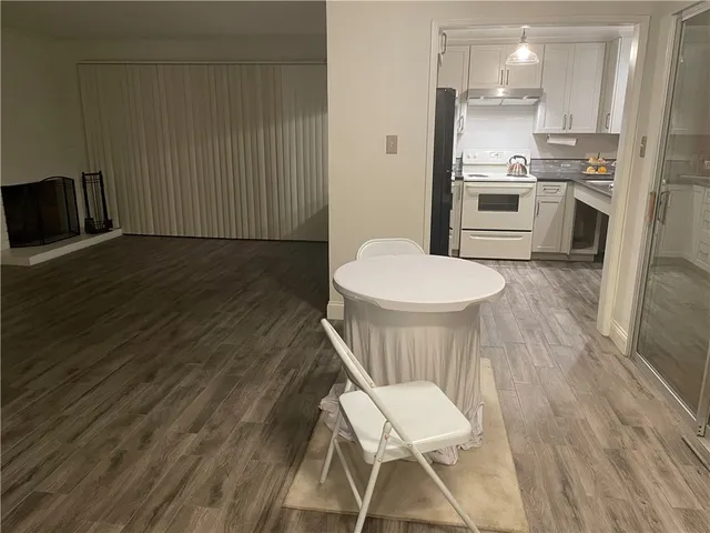 a kitchen with a table and chairs in it