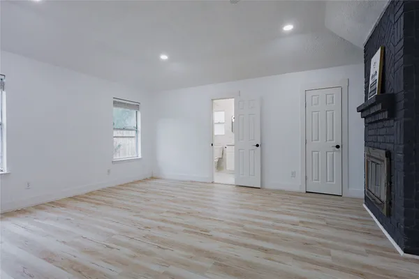 a bedroom with bed and a chandelier