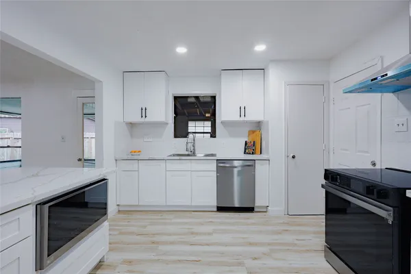 a view of entryway with wooden floor