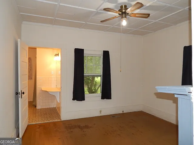 a view of an empty room with a window