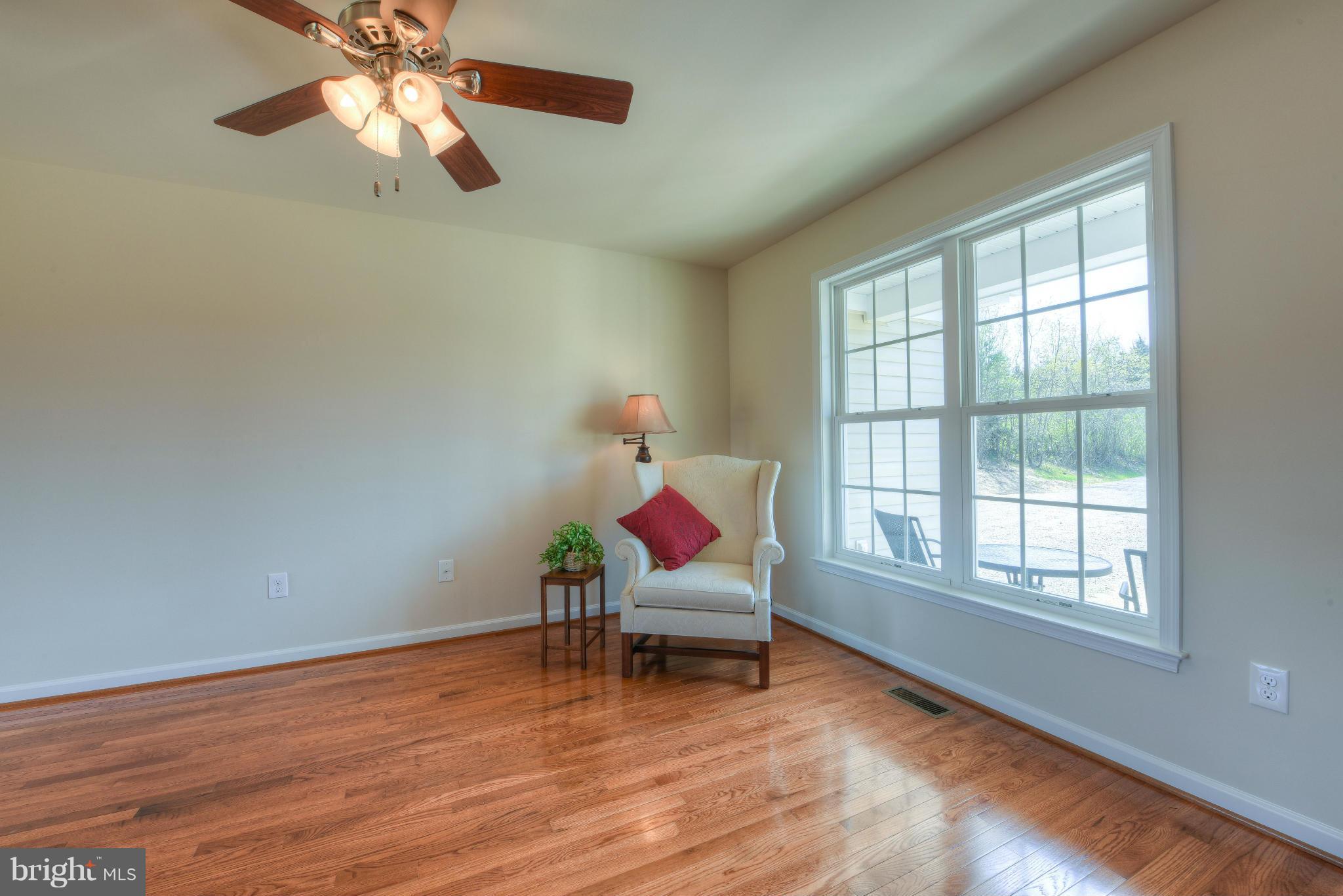 12163 Ridge Road King George, VA 22485 - Photo 11 of 30 CEILING FAN IN OPEN LIVING AREA