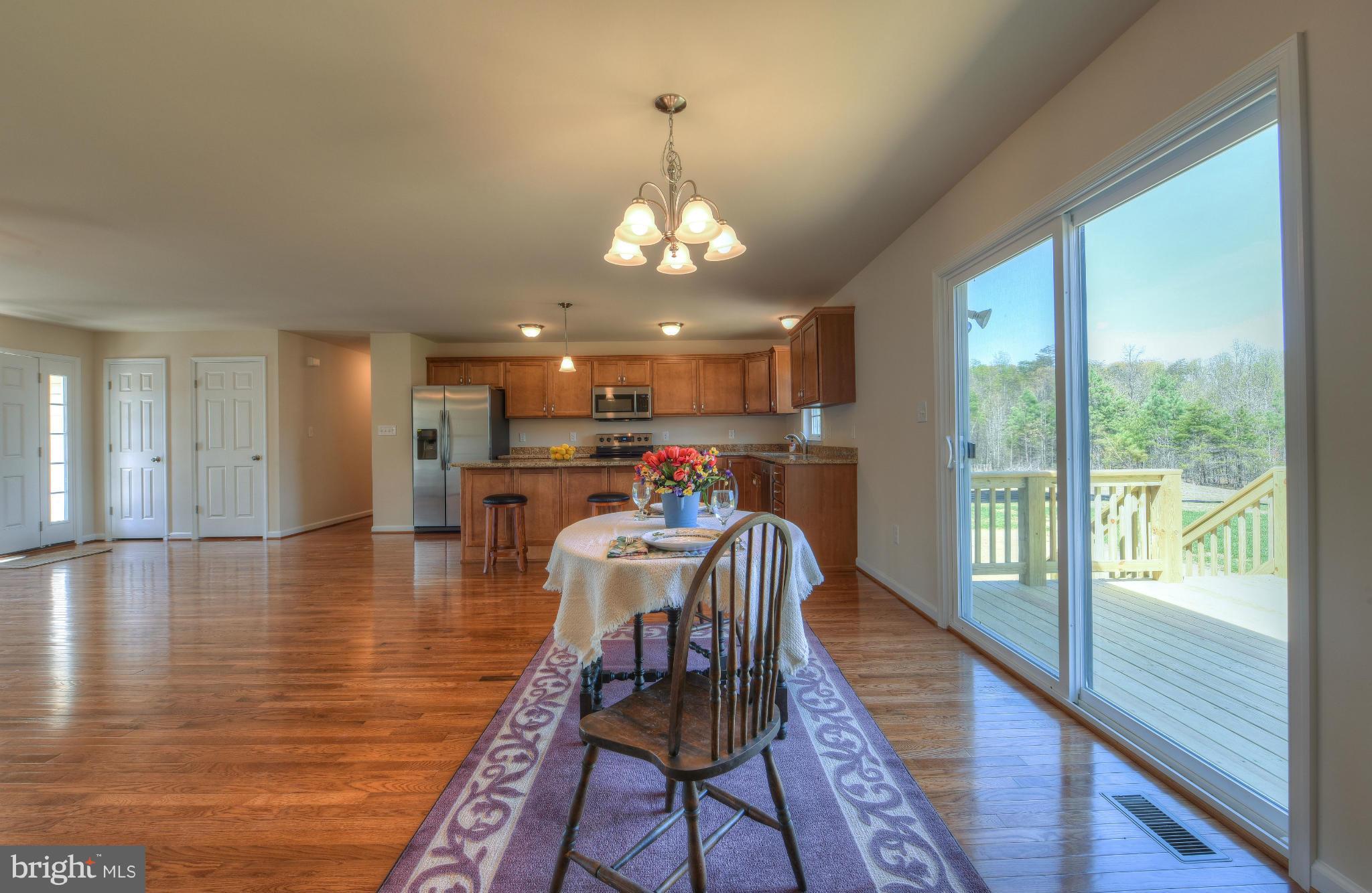 12163 Ridge Road King George, VA 22485 - Photo 16 of 30 DINING OPEN TO DECK AND LIVING AREA