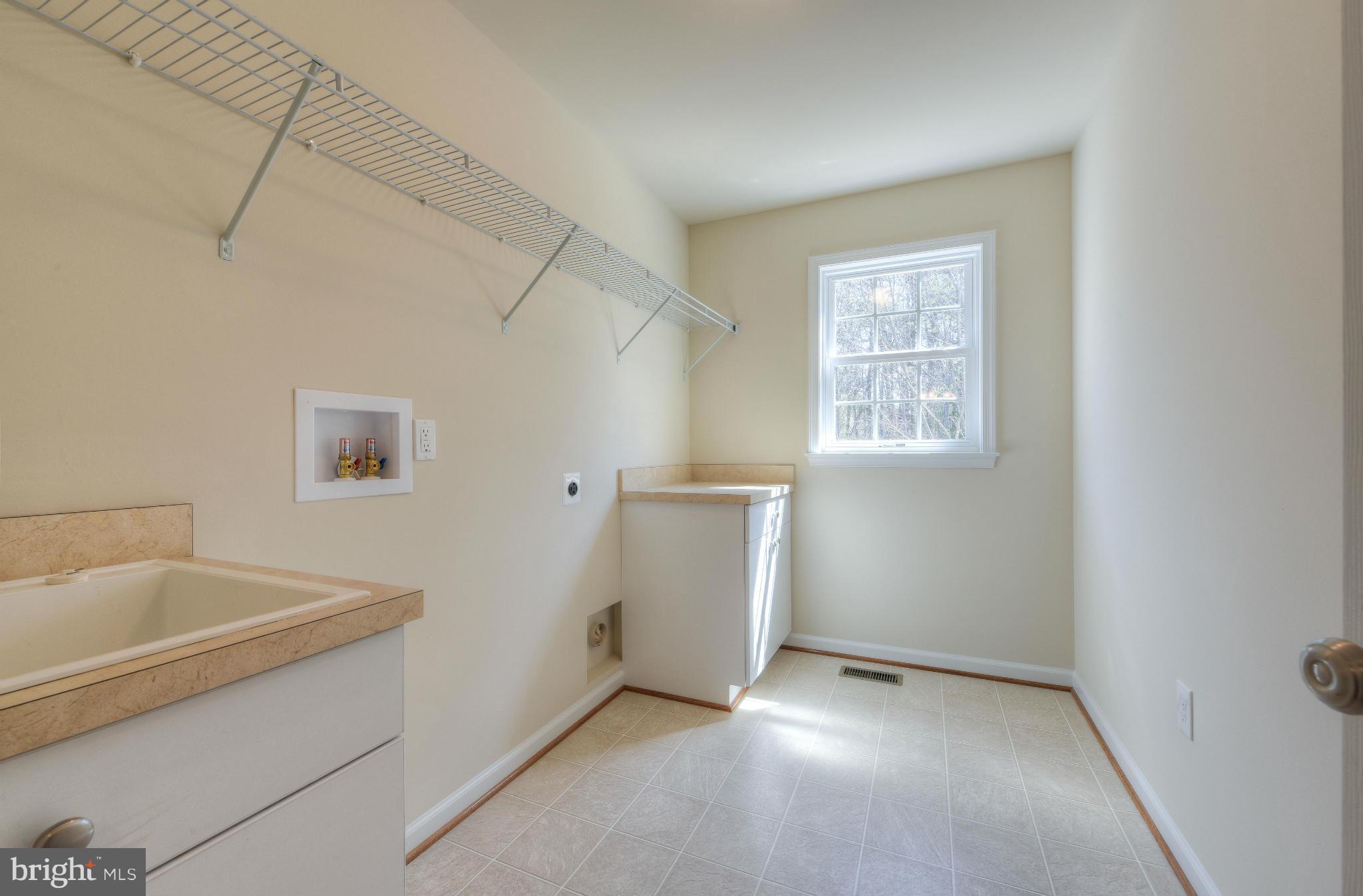12163 Ridge Road King George, VA 22485 - Photo 19 of 30 LAUNDRY RM AND SINK LOTS OF STORAGE