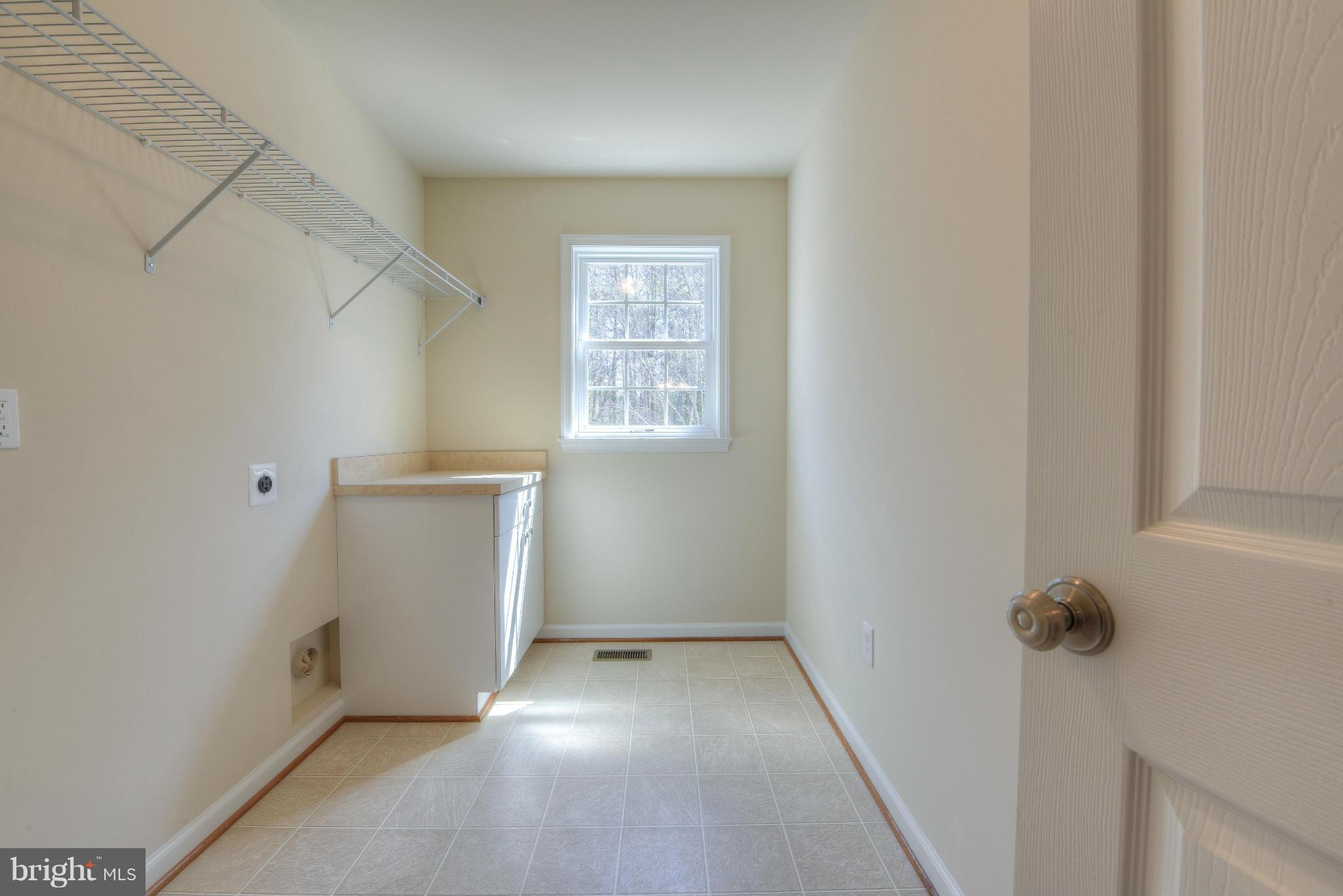 12163 Ridge Road King George, VA 22485 - Photo 20 of 30 FOLDING TABLE IN LAUNDRY ROOM