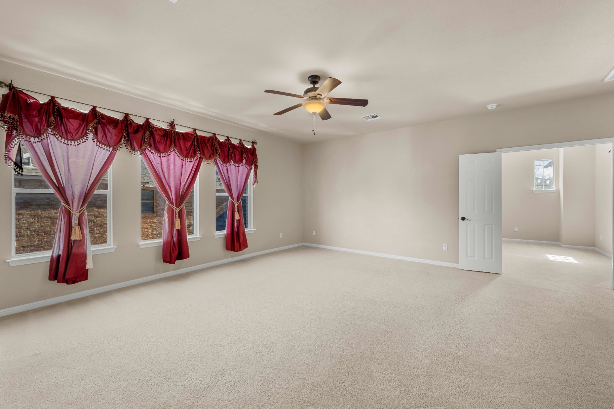 3903 Remington Road Cedar Park, TX 78613 - Photo 14 of 29 An airy bedroom with pristine carpet and a ceiling fan provides a comfortable retreat.
