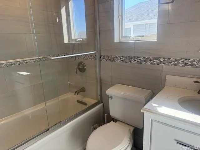 a bathroom with a toilet and a bathtub