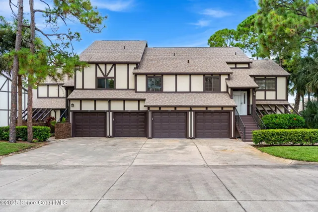 a view of house with outdoor space and sitting area