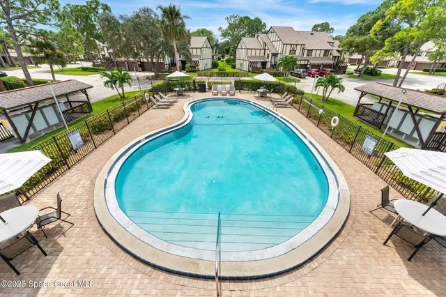 a view of a swimming pool with a lounge chairs