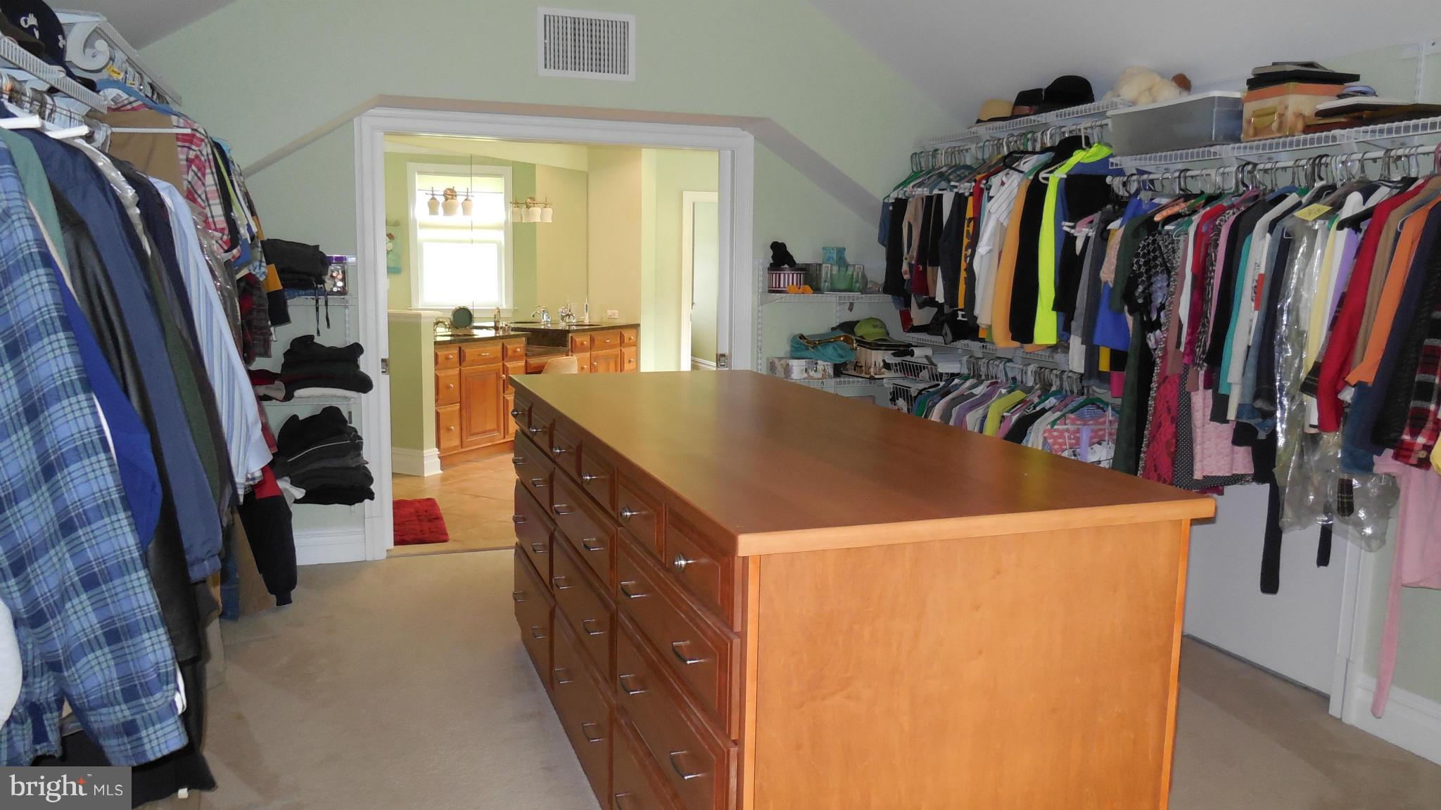 11601 Matthews Road Keymar, MD 21757 - Photo 24 of 30 a view of walk in closet with clothes and shoes