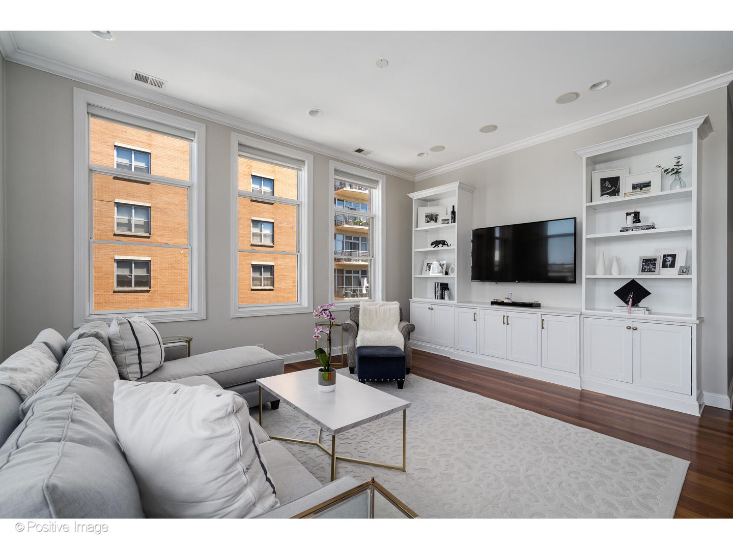 955 West Monroe Street, Unit 4A Chicago, IL 60607 - Photo 12 of 24 a living room with furniture and a flat screen tv