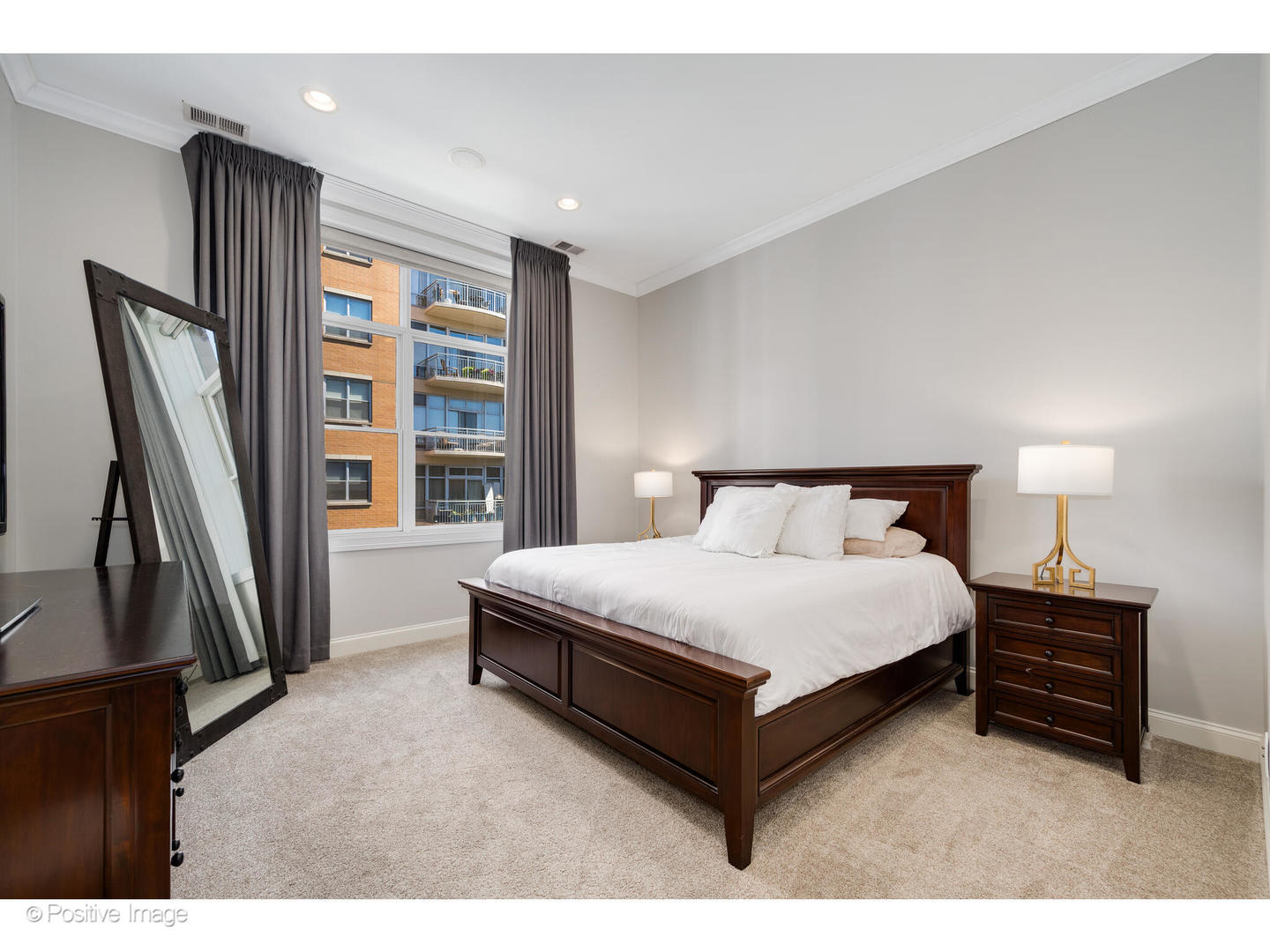 955 West Monroe Street, Unit 4A Chicago, IL 60607 - Photo 13 of 24 a spacious bedroom with a bed lamp and a large window
