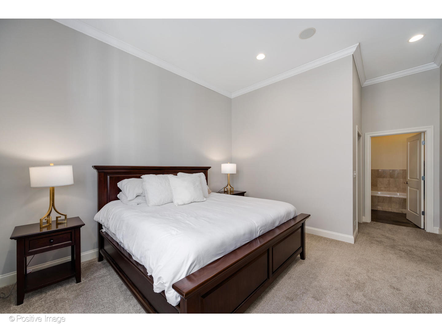 955 West Monroe Street, Unit 4A Chicago, IL 60607 - Photo 14 of 24 a bedroom with a bed and a lamp