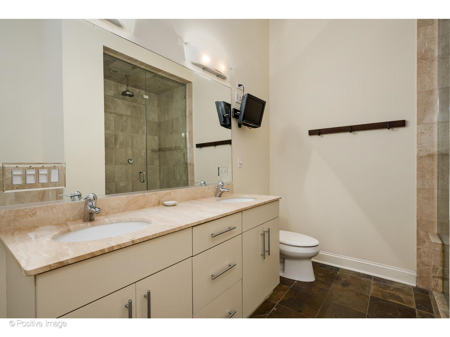 955 West Monroe Street, Unit 4A Chicago, IL 60607 - Photo 16 of 24 a bathroom with a sink a toilet and mirror