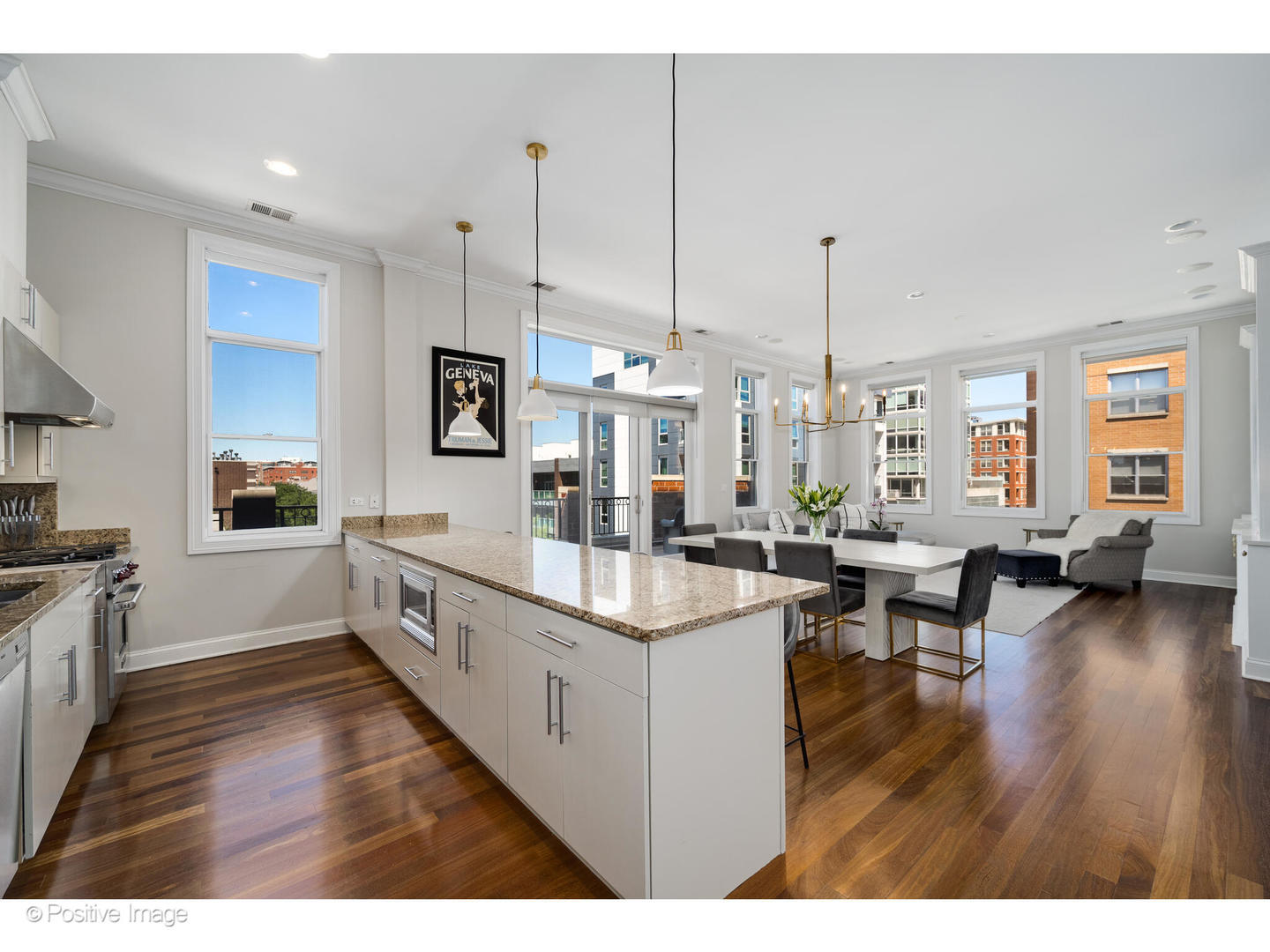 955 West Monroe Street, Unit 4A Chicago, IL 60607 - Photo 4 of 24 a large kitchen with stainless steel appliances kitchen island granite countertop a large center island attached withe living room