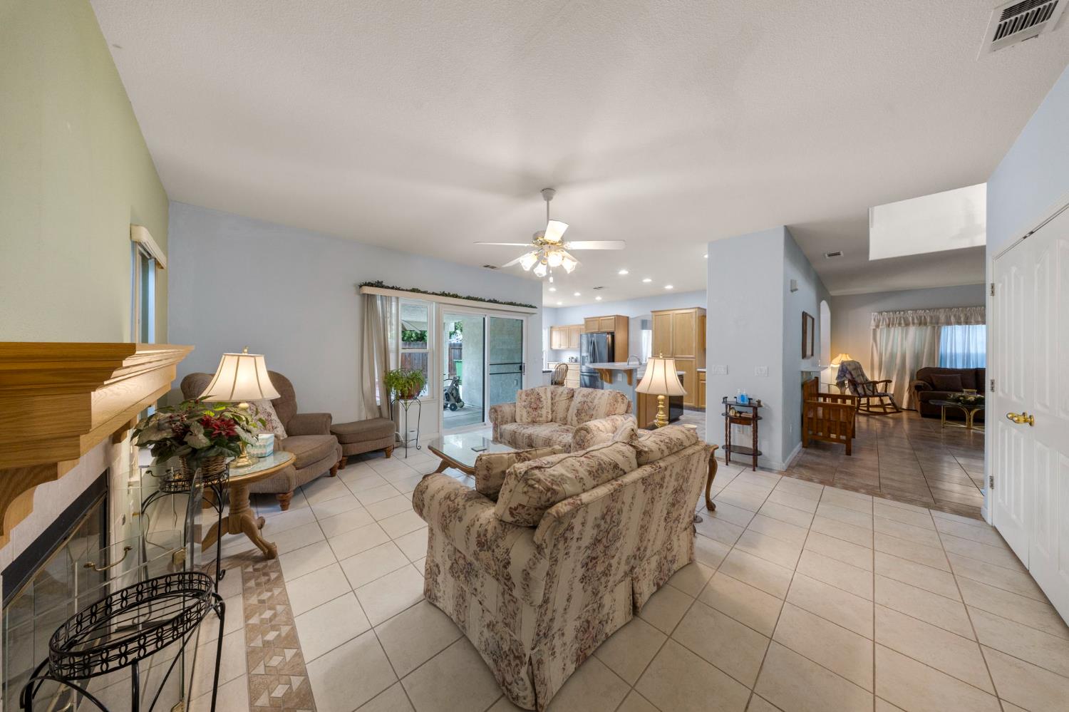 2101 Arabian Way Turlock, CA 95380 - Photo 13 of 38 a living room with furniture and a chandelier