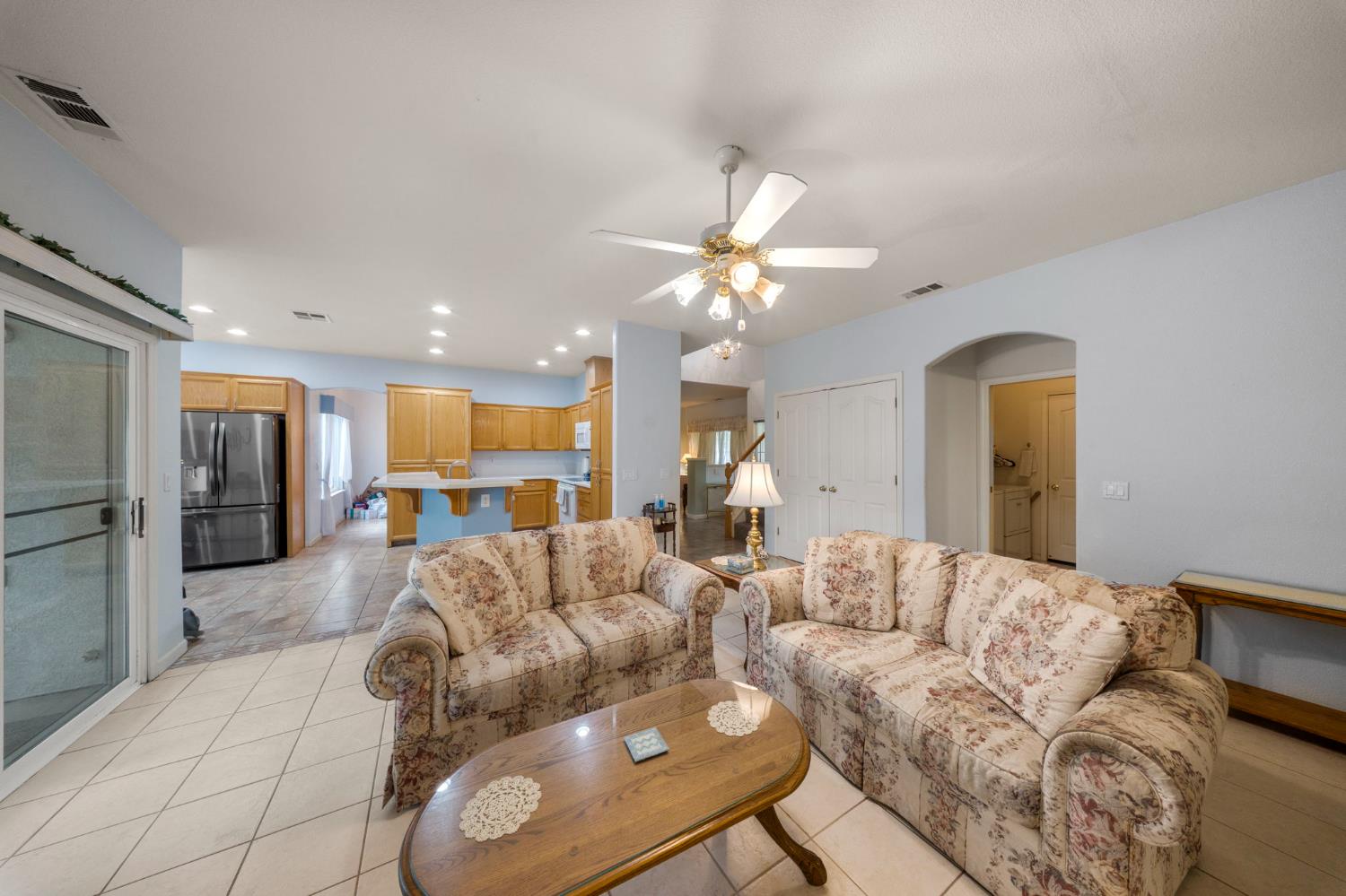 2101 Arabian Way Turlock, CA 95380 - Photo 14 of 38 a living room with furniture and a chandelier