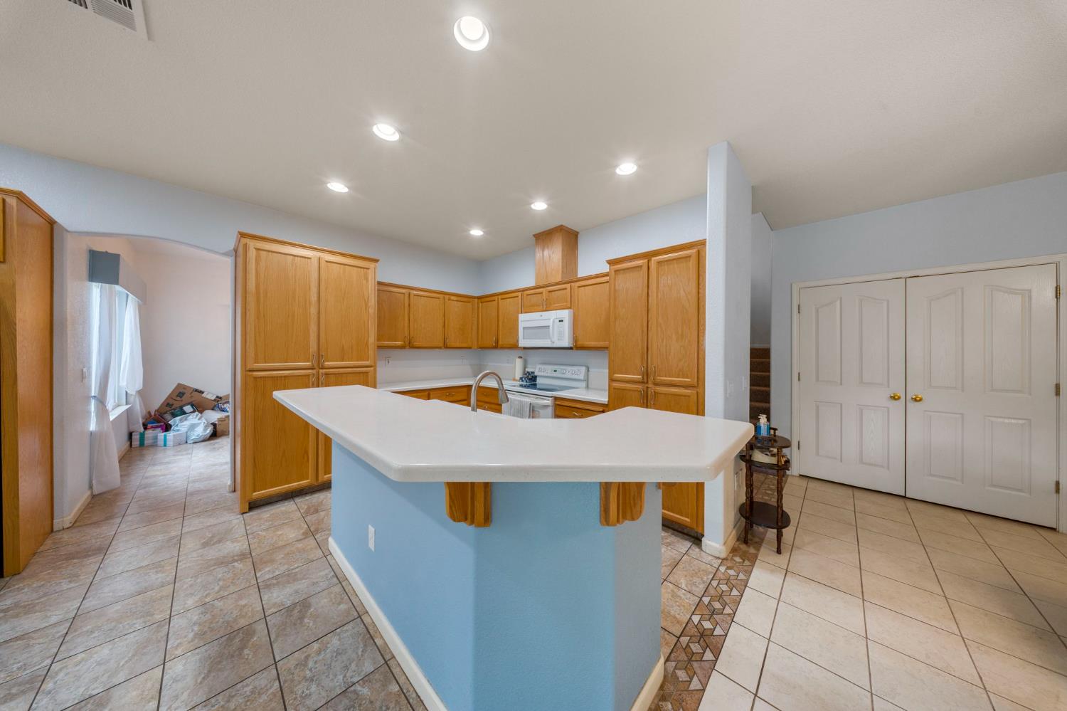 2101 Arabian Way Turlock, CA 95380 - Photo 16 of 38 a large kitchen with a large counter top appliances and cabinets