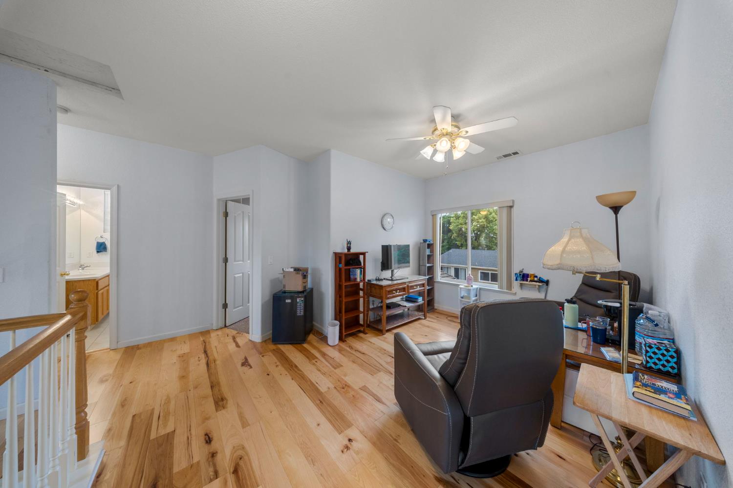 2101 Arabian Way Turlock, CA 95380 - Photo 27 of 38 a living room with furniture and a chandelier