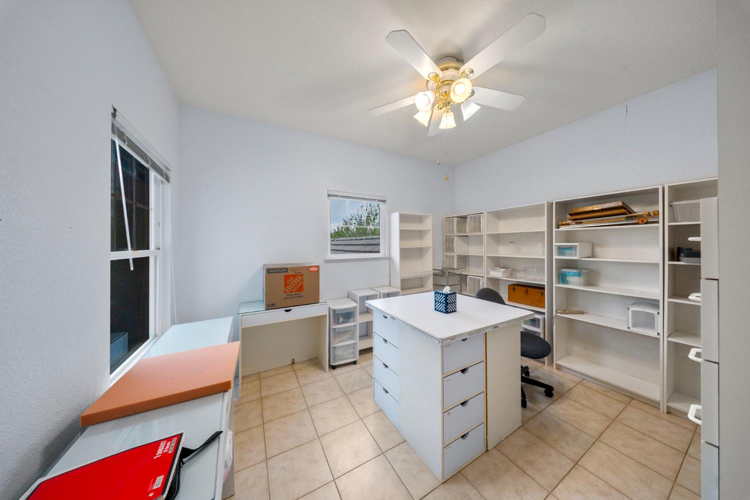 2101 Arabian Way Turlock, CA 95380 - Photo 28 of 38 a room with a bed and a chandelier