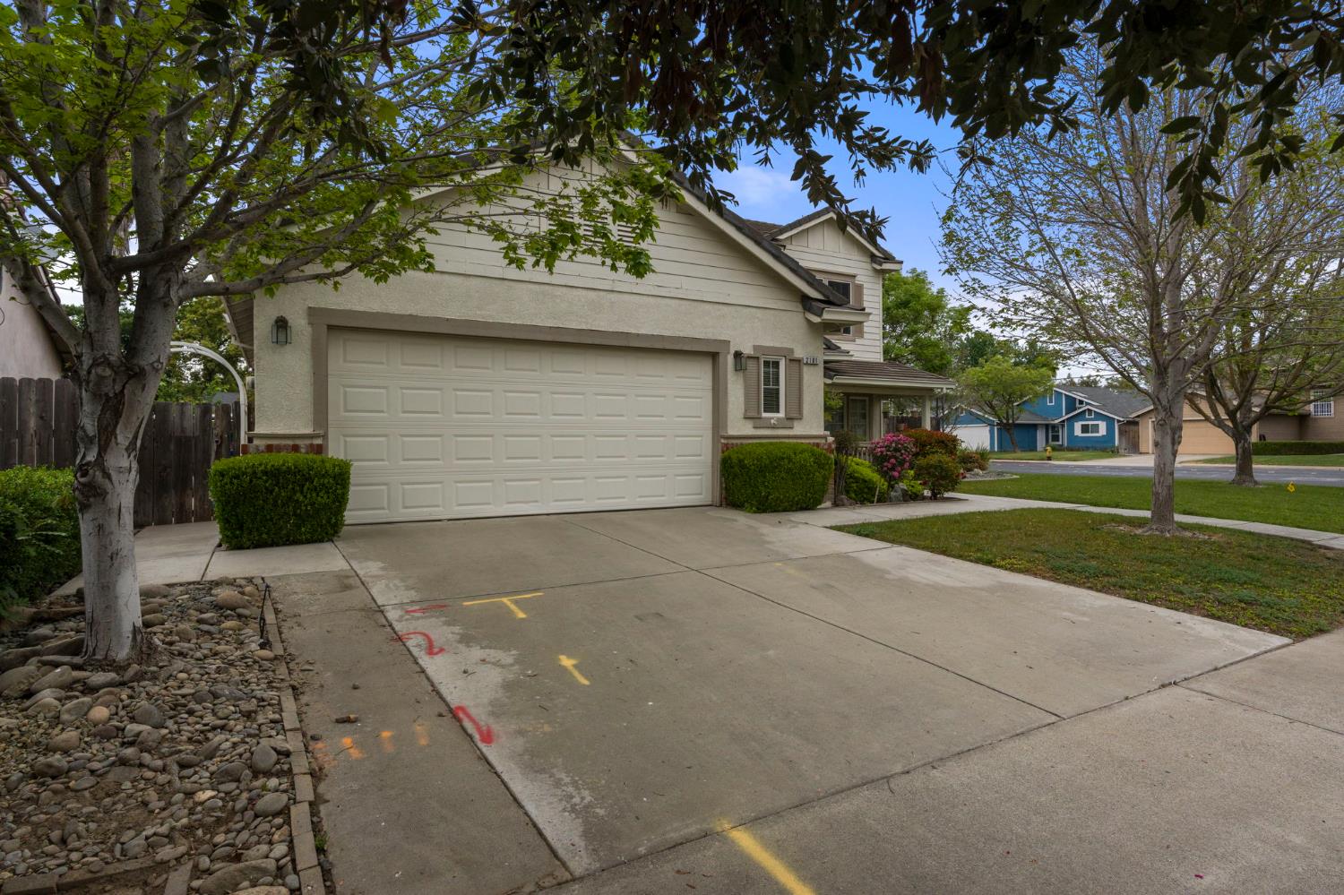 2101 Arabian Way Turlock, CA 95380 - Photo 3 of 38 a front view of a house with a yard and a garage