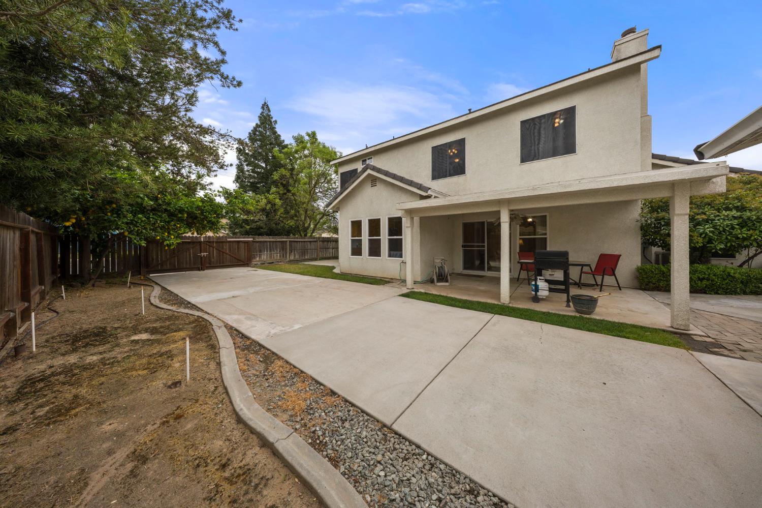 2101 Arabian Way Turlock, CA 95380 - Photo 37 of 38 a view of a house with backyard and sitting area
