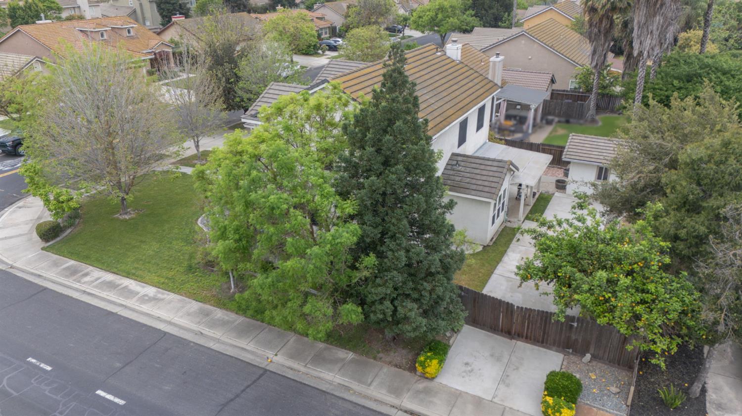 2101 Arabian Way Turlock, CA 95380 - Photo 6 of 38 an aerial view of a house with garden space and sitting area