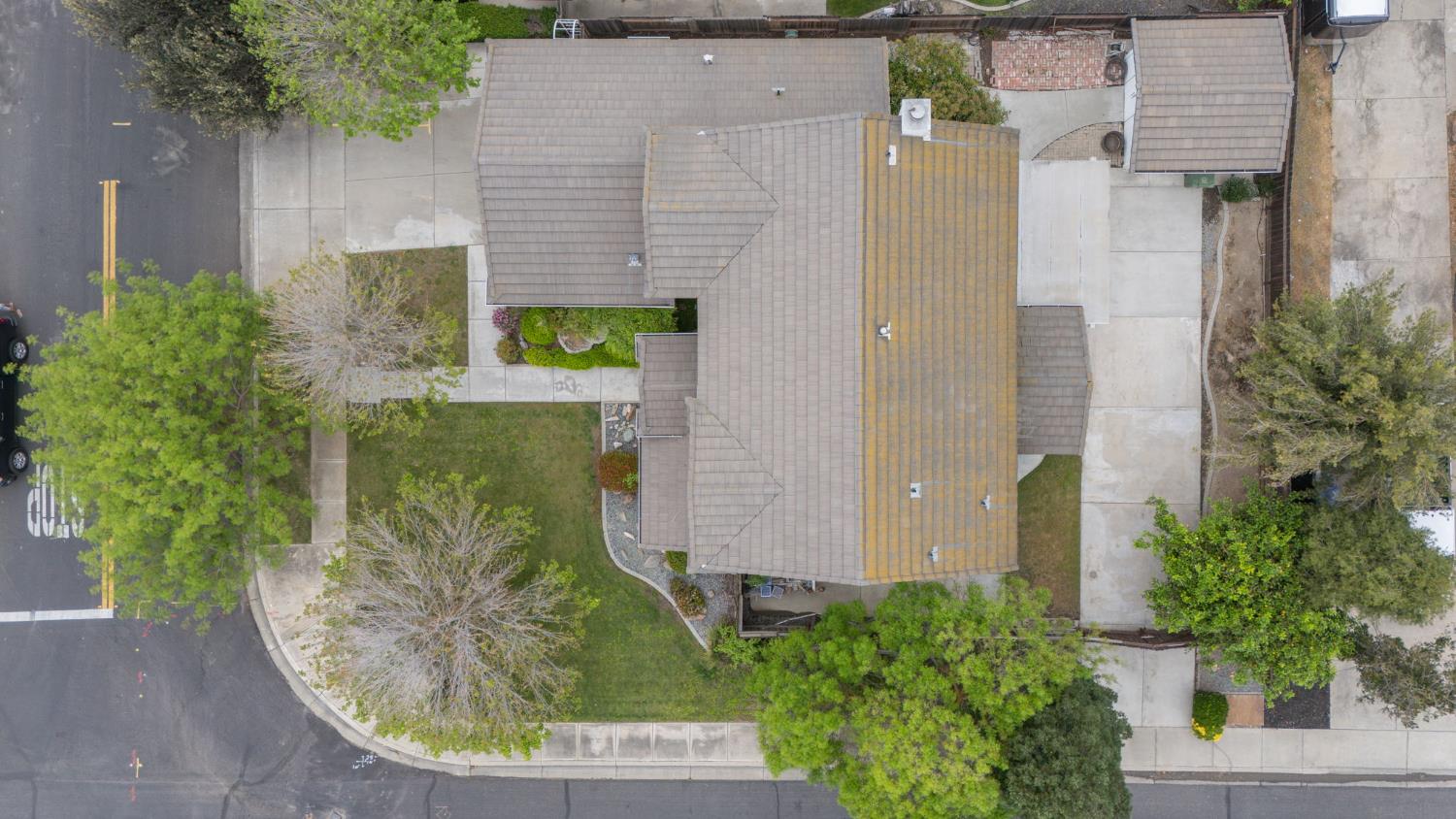 2101 Arabian Way Turlock, CA 95380 - Photo 7 of 38 an aerial view of a multi story residential apartment building with a yard and potted plants