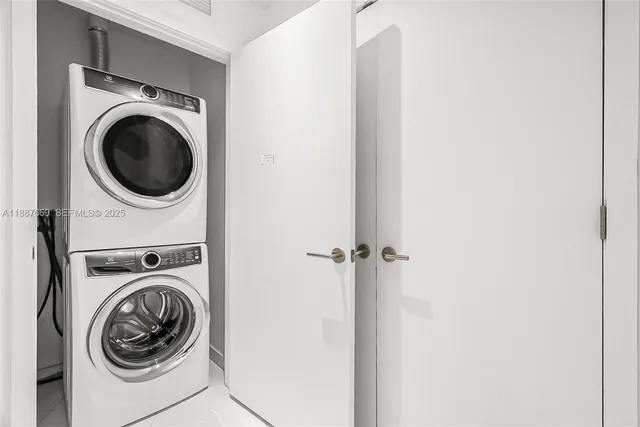 a view of storage and utility room with washer and dryer