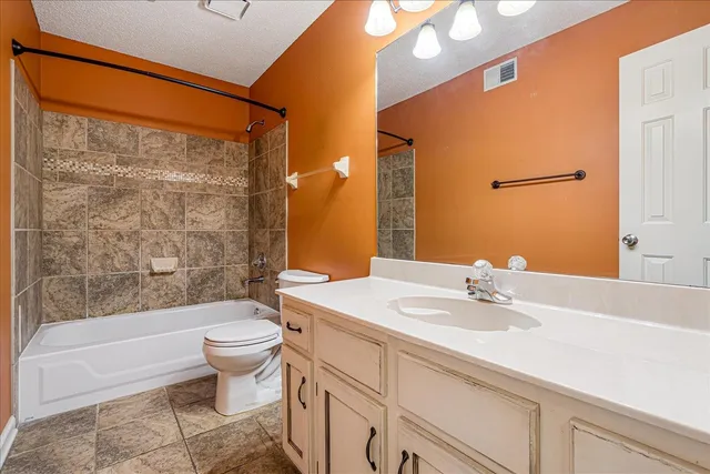 a bathroom with a sink a toilet and a bathtub