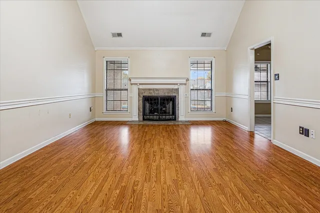 a view of an entryway with wooden floor