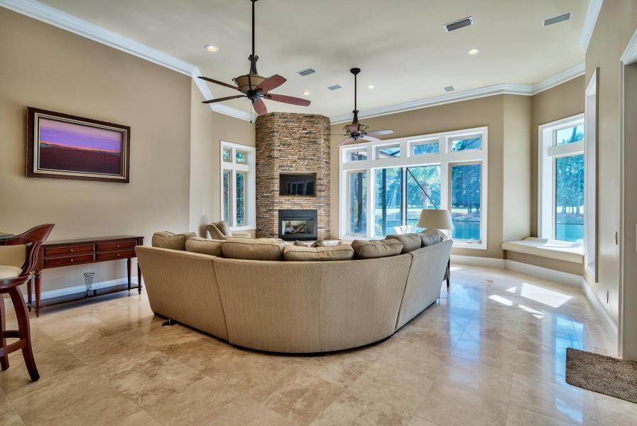 2918 Sand Pine Road Miramar Beach, FL 32550 - Photo 3 of 25 a living room with furniture and a chandelier