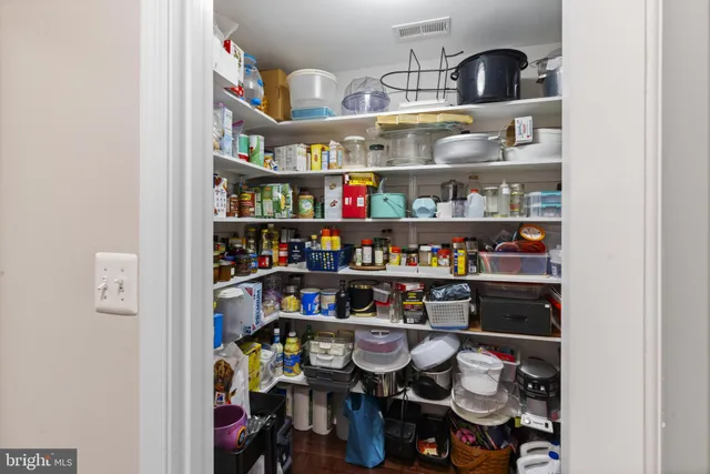 a shelf with cup and plates