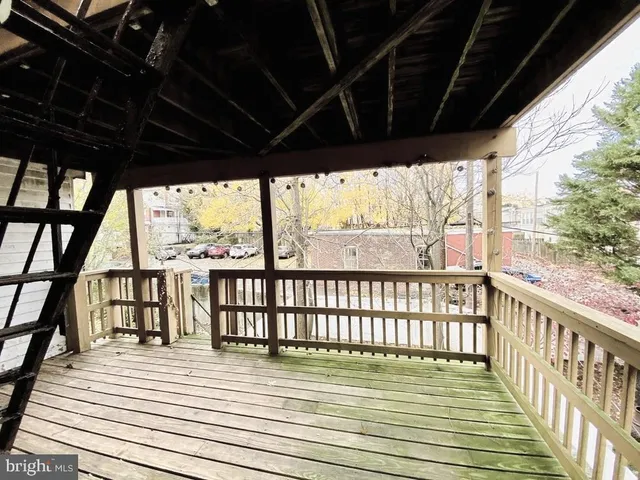 a view of balcony with wooden floor