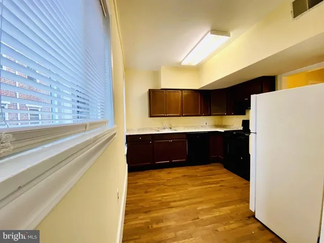 a bathroom with a tub and a mirror