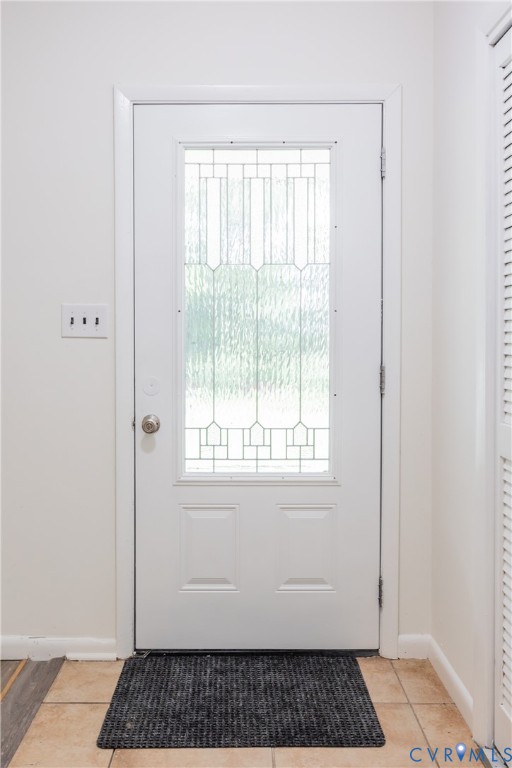 9016 Robin Road Disputanta, VA 23842 - Photo 11 of 30 Doorway to outside featuring baseboards