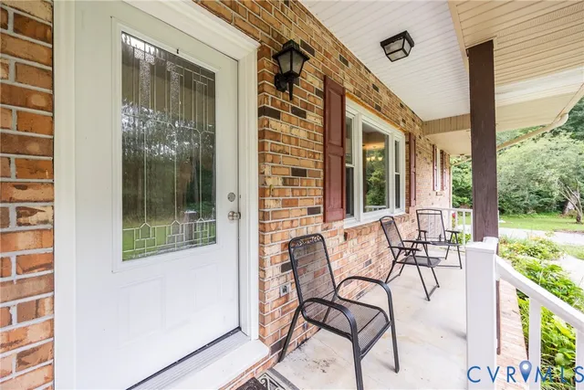 a view of a balcony with chairs