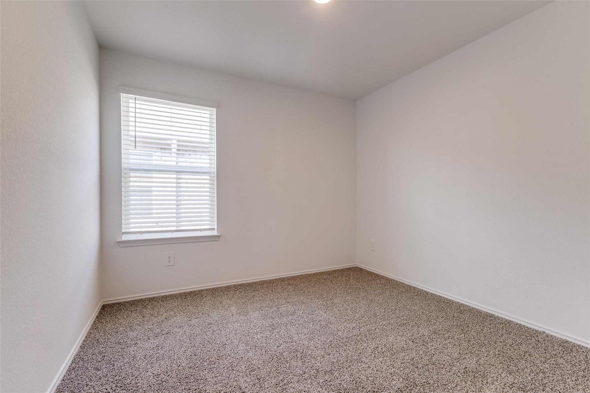 24323 Cayman Heights Lane Spring, TX 77373 - Photo 3 of 12 an empty room with a window