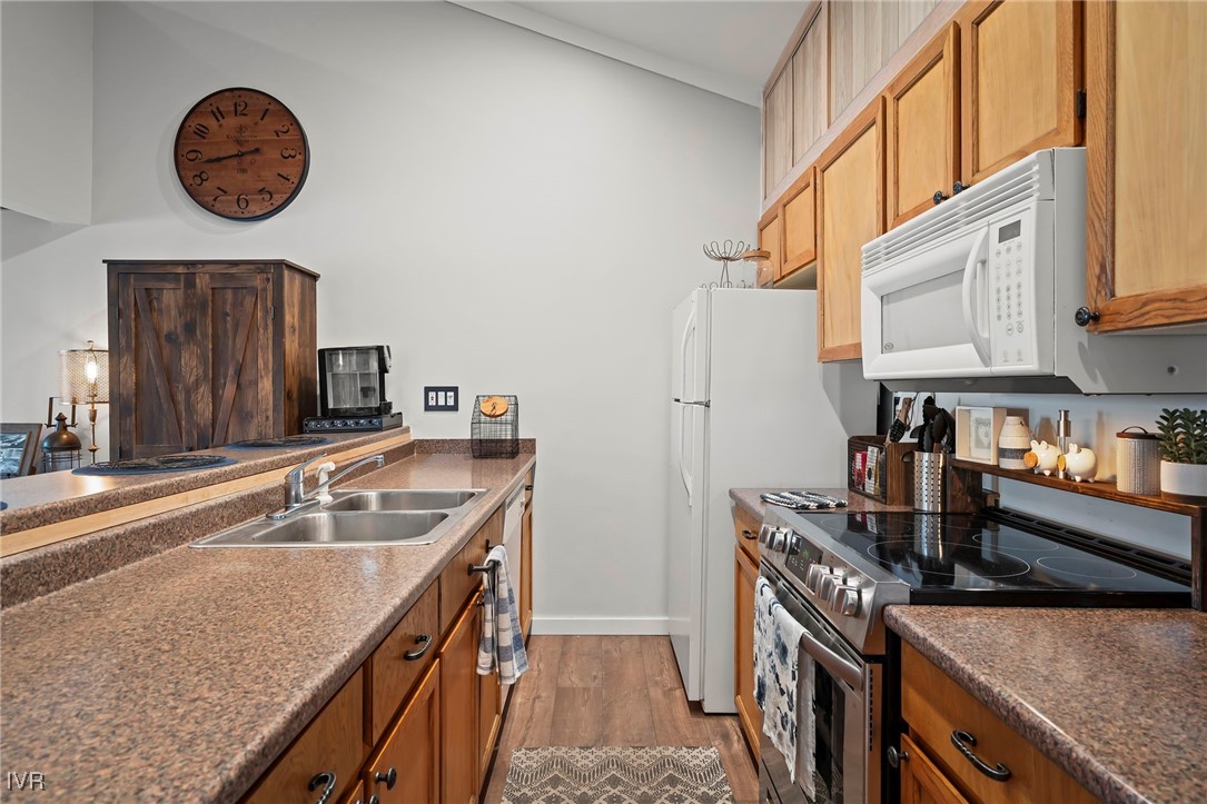 948 Harold Drive, Unit 15 Incline Village, NV 89451 - Photo 11 of 30 a kitchen with stainless steel appliances granite countertop a sink stove and refrigerator