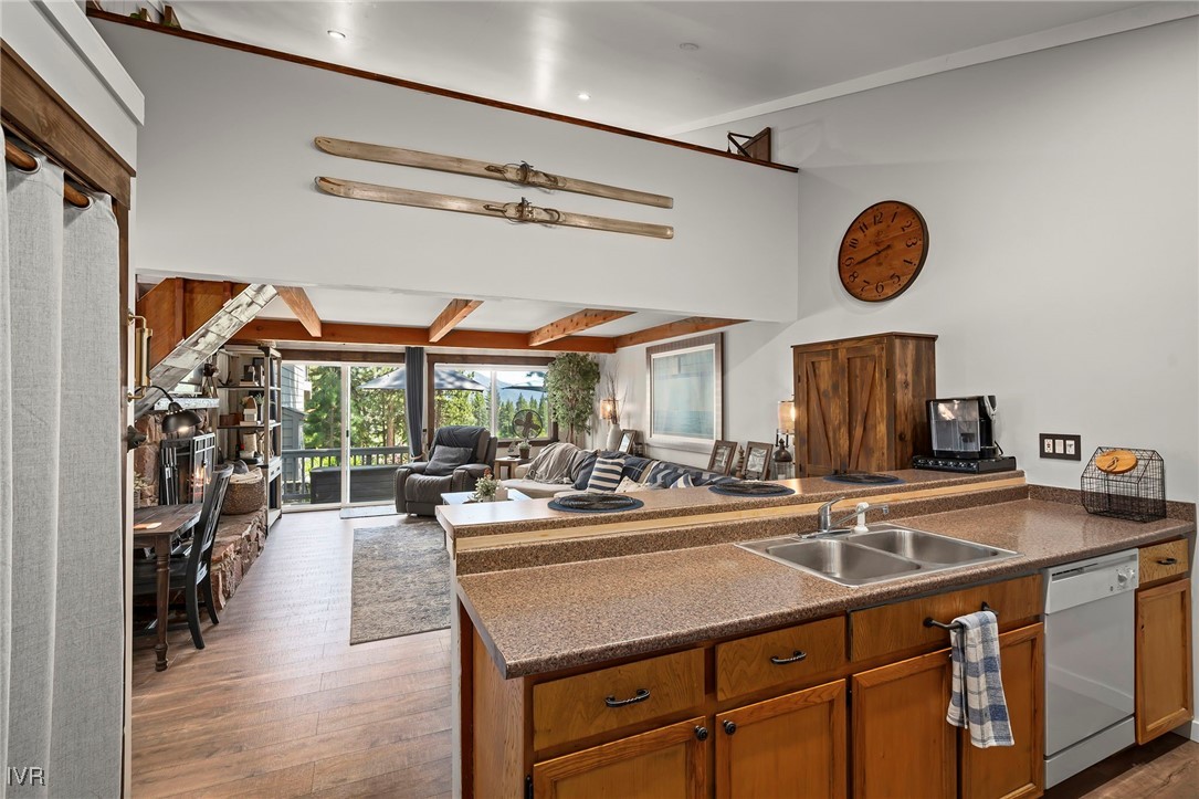948 Harold Drive, Unit 15 Incline Village, NV 89451 - Photo 12 of 30 a kitchen with stainless steel appliances granite countertop a sink and a stove next to a window